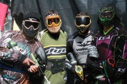 Photo of four paintball players wearing masks